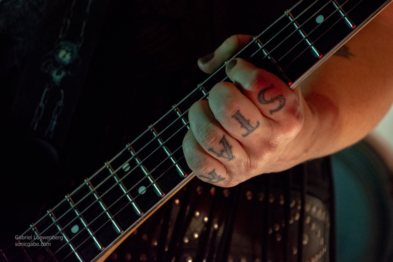 Her other hand says βROCKβ but I couldnβt get them both in the same shot. I mostly got βOCKβ